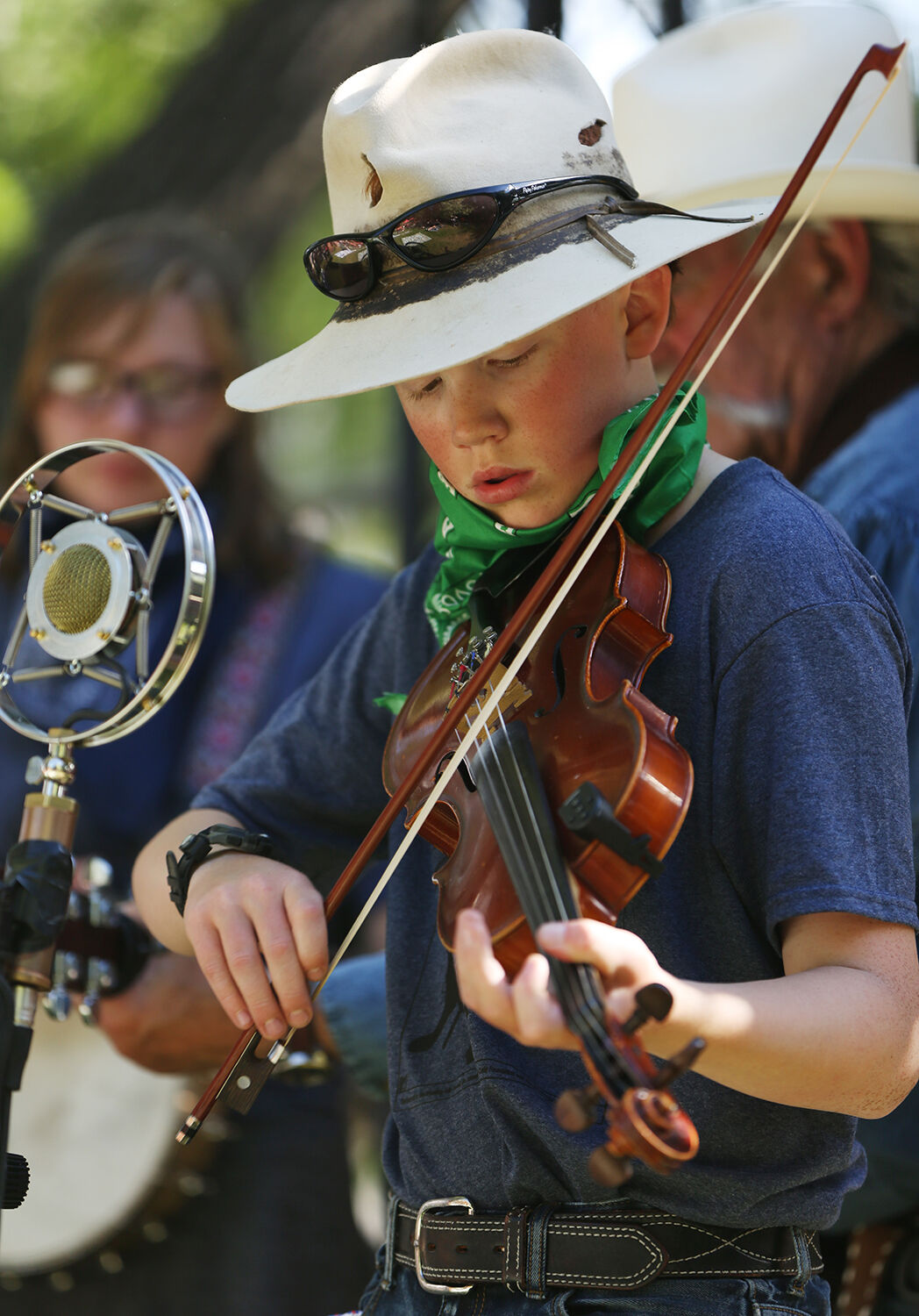 Riley Rankin looks down at his bow during one of his several performances